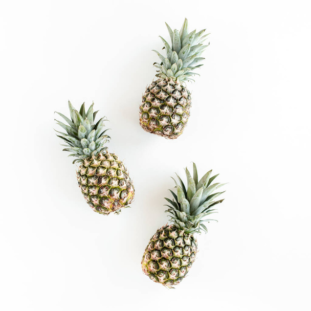 Pineapples isolated on white background. Food concept. Flat lay, top view - Фото, изображение