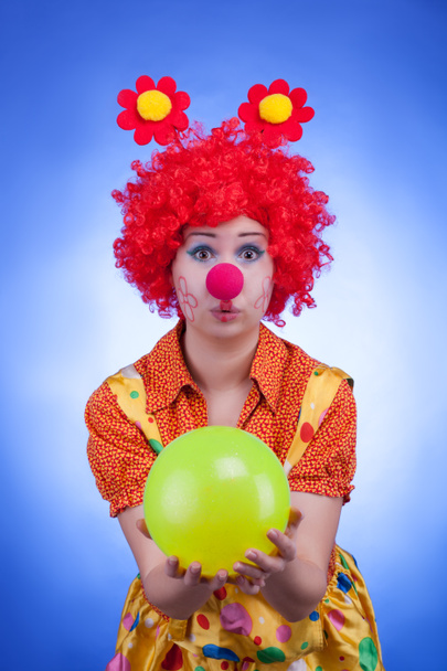 Clown woman character on blue background - 写真・画像