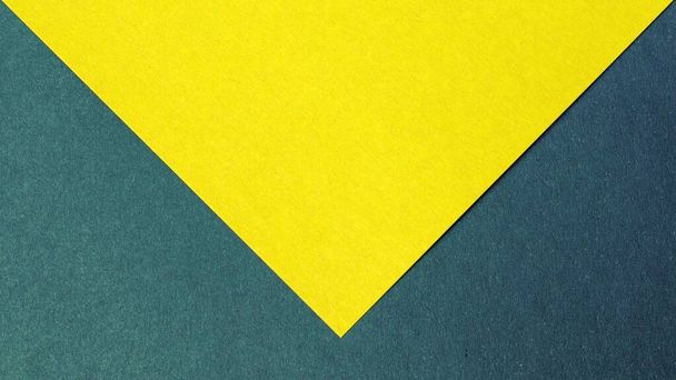 Geometric yellow background with dark gray triangular inserts at the corners. Copy space. - Photo, Image