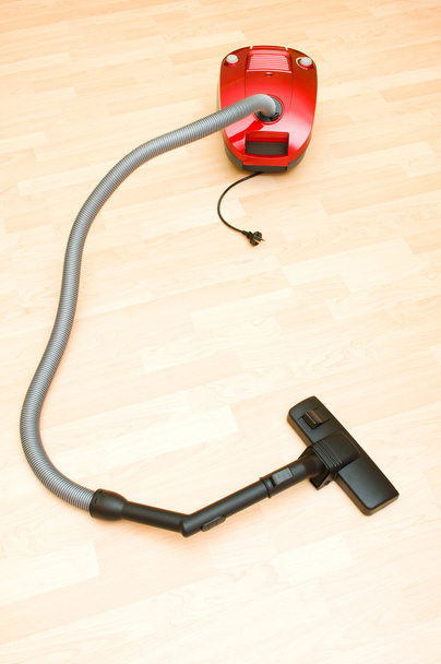 Vacuum cleaner on the wooden floor - Photo, Image