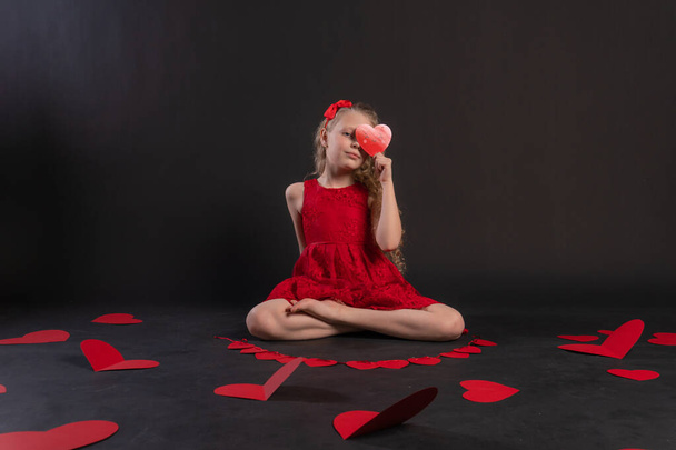 paper hearts valentine, happy valentine, on the floor hearts married space. the honeymoon. love formula of love, frame in red dress girl, barefoot - Valokuva, kuva