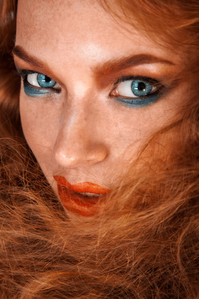 Beautiful girl with freckles on healthy skin looking at camera - Valokuva, kuva