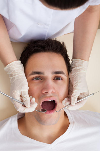 Man Going Through Dental Examination In Clinic - Φωτογραφία, εικόνα