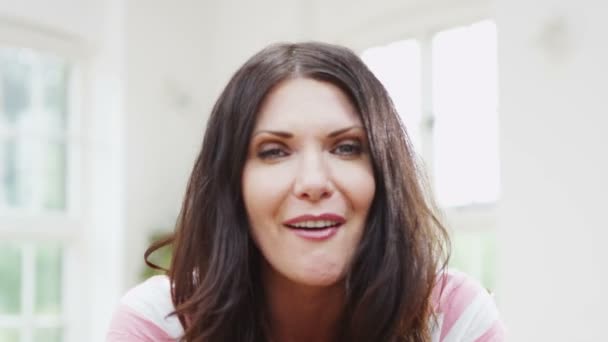 Cheerful woman video chatting - Felvétel, videó