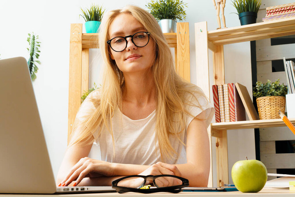 Young woman and tablet working at home office. Stay safe and working from home. - 写真・画像