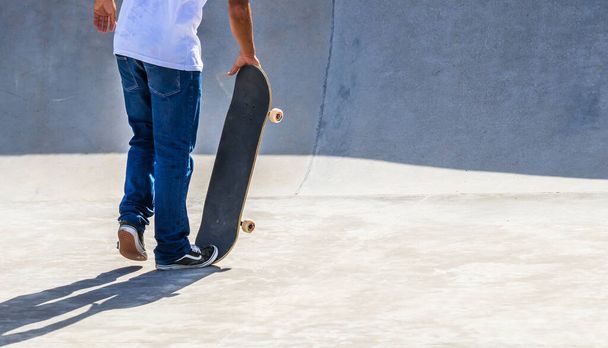 A young person skateboarding in - 写真・画像