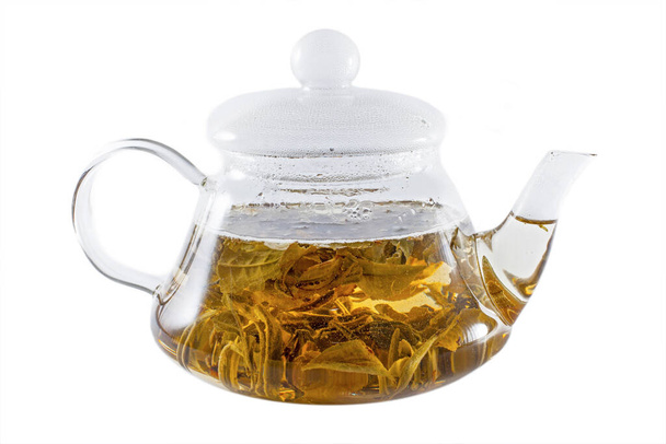 Скляний горщик гарячого свіжого зеленого чаю
 - Фото, зображення