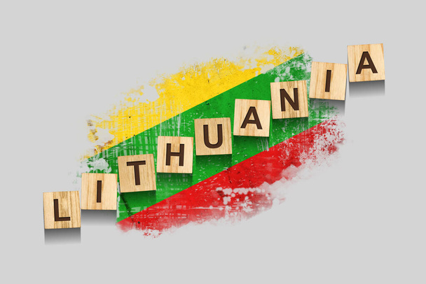 Litvánia. A fablokkokra vésett felirat Litvánia zászlajának hátterében. 3D illusztráció. Szürke háttérrel elszigetelve. Tervezési elem - Fotó, kép