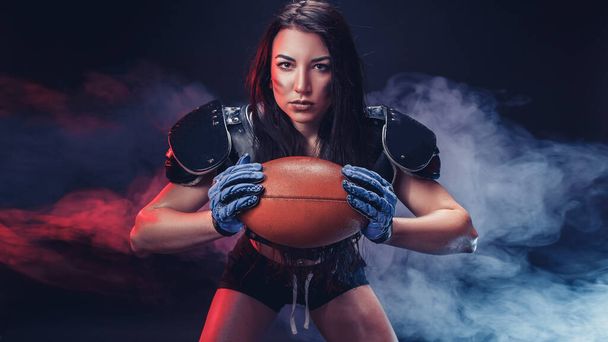 Sportive woman with rugby ball - Foto, Imagen