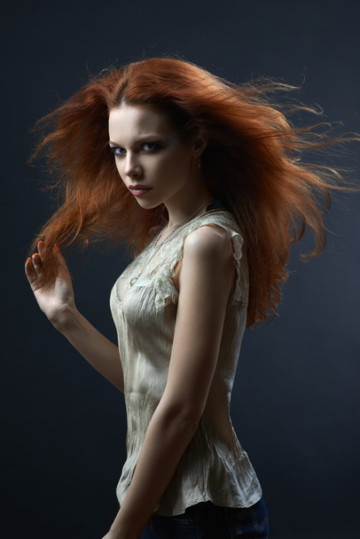beautiful red-haired girl in the dark - Фото, изображение