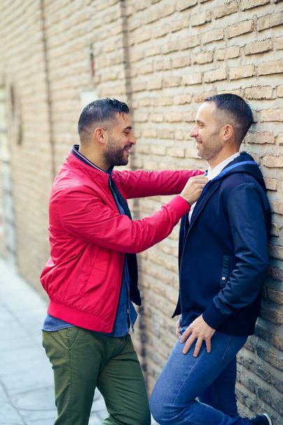 Gay couple in a romantic moment on the street. - Photo, Image