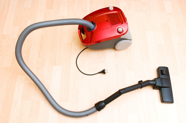 Vacuum cleaner on the wooden floor - Foto, immagini