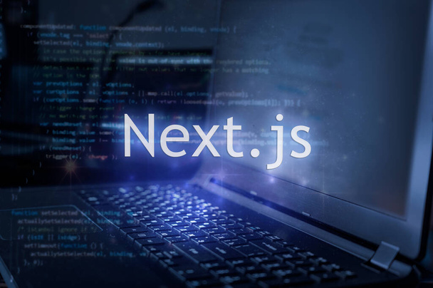 Next.js inscription against laptop and code background. - Photo, Image