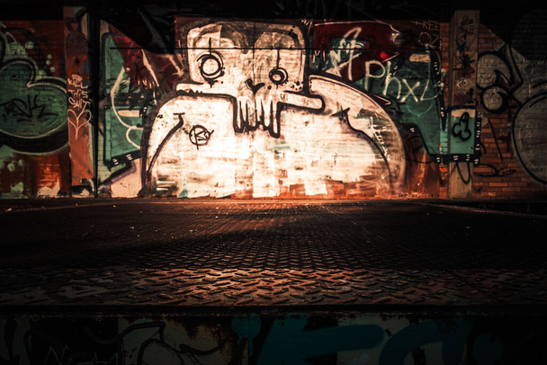 Graffiti work in an industrial teal & orange atmosphere - Foto, Imagen