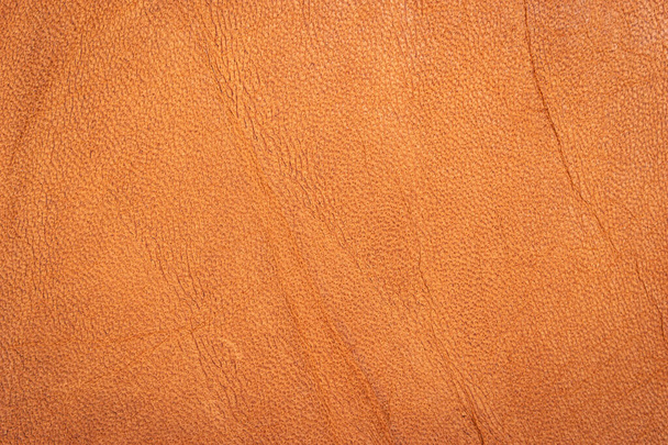 Кожаный коричневый фон, текстура кожаного материала. - Фото, изображение