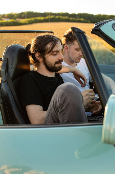 Relaxing young boys models sitting in the car - Фото, зображення