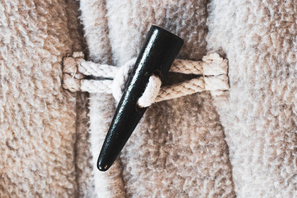 Close up of toggle on warm woolen sweater with retro vibe - Fotoğraf, Görsel