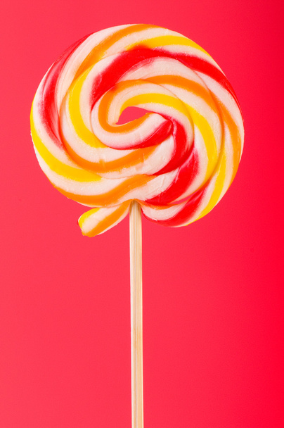 Colourful lollipop against the colourful background - Foto, imagen