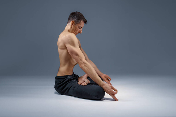 Male yoga maditates in classical pose - Photo, Image