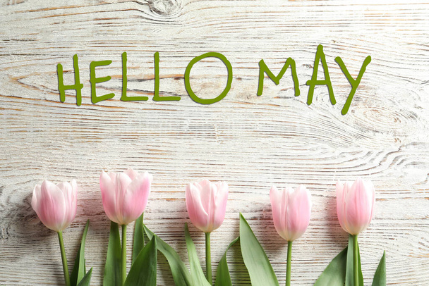Hello May. Beautiful spring tulips on wooden background, flat lay - Fotó, kép