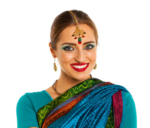 Young beautiful brunette woman in indian dress - Фото, зображення