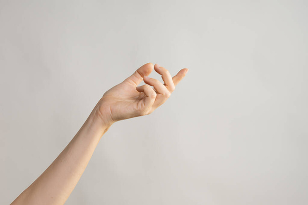 Hand gestures. Elegant female hand, pointing to the side - Zdjęcie, obraz