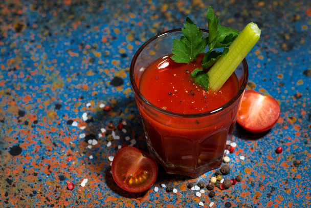 healthy tomato juice with salt and celery on dark table, top view horizontal - Photo, Image