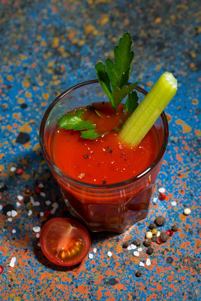 healthy tomato juice with salt and celery on dark table, top view - Foto, imagen