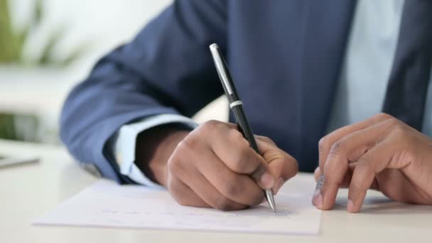 Hands of African Businessman Writing on Paper  - Footage, Video