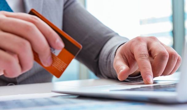 Male businessman doing online shopping with credit card - Fotó, kép