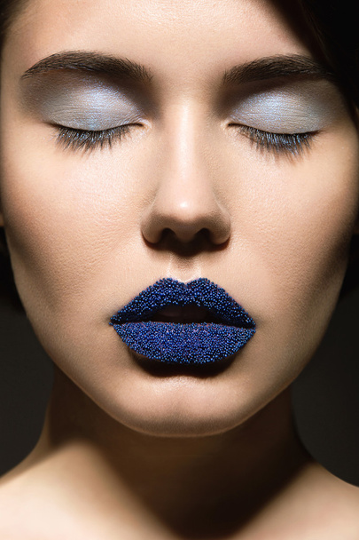 Beautiful girl with unusual blue lips - Фото, изображение