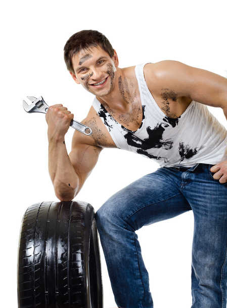 Workman hold rubber-tire - Фото, изображение