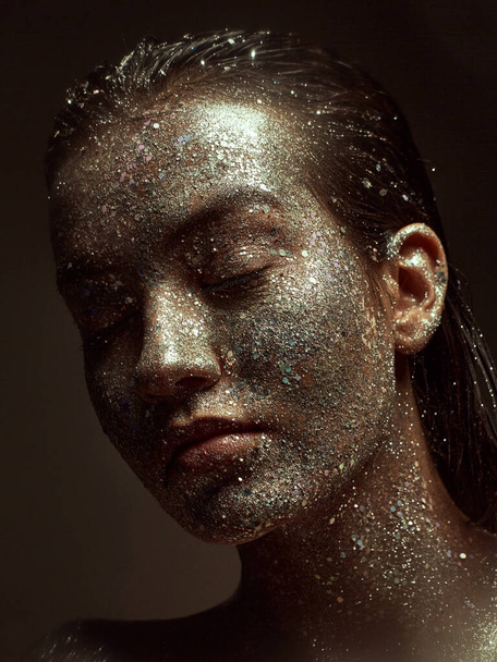 Glittering silver make up on female face, young beautiful girl with wet hair and sparkling body art, close up portrait - Φωτογραφία, εικόνα