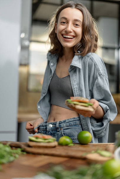 Happy slim woman showing her weight loss - Fotoğraf, Görsel