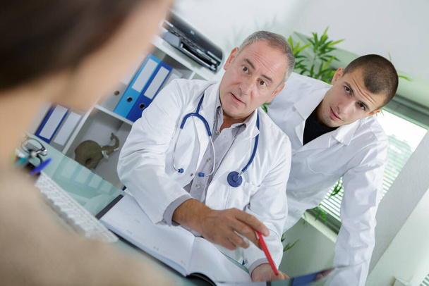 doctor and patient are discussing something - 写真・画像