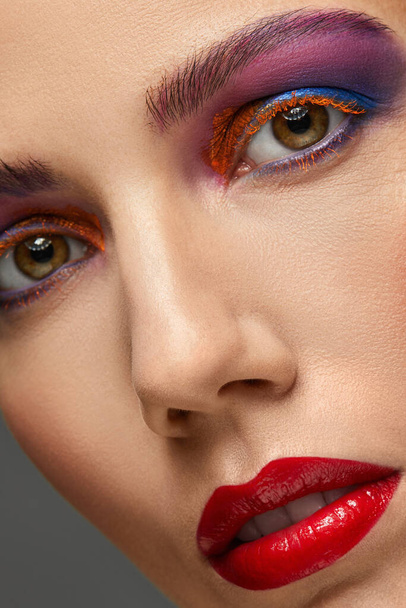 Close-up of woman with colorful makeup. - Foto, imagen