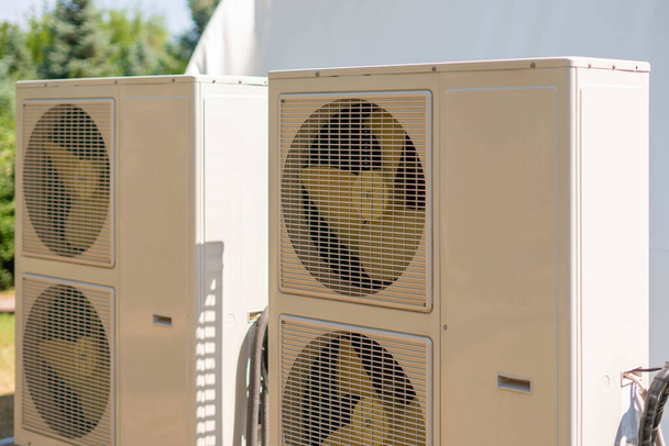 a split system air conditioner unit outdoors with air cleaning equipment - Photo, Image