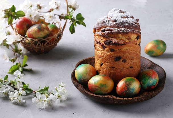 Easter cake Craffin and marble colorful eggs on gray background. Concept of the spring orthodox church holiday. - Photo, Image