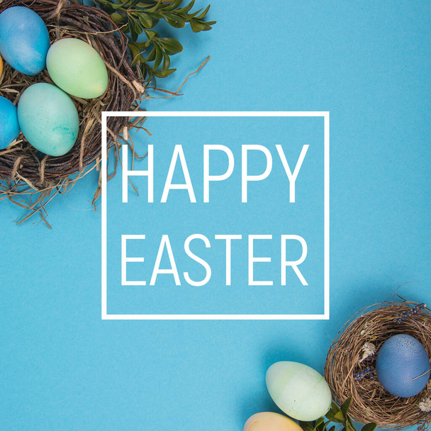 Colorful background with Easter eggs on blue background. Happy Easter concept. Can be used as poster, background, holiday card. Studio Photo - 写真・画像