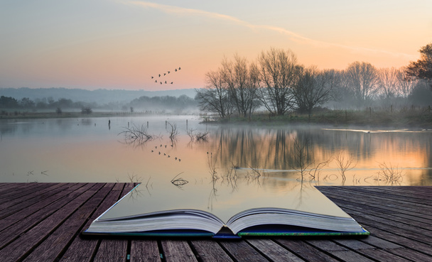 Book concept Landscape of lake in mist with sun glow at sunrise - Photo, Image
