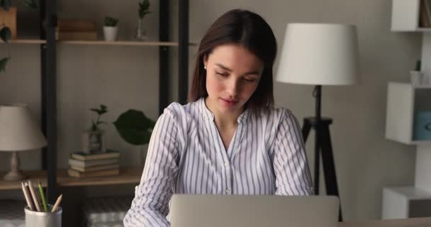 Happy millennial beautiful woman finishing computer work. - Materiał filmowy, wideo