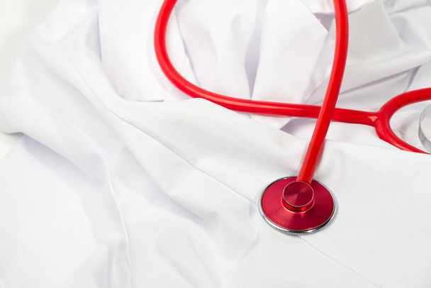 Red stethoscope on white background, close up - Photo, Image