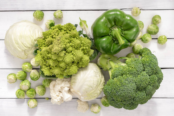 Assorted cabbage. Brussels sprouts, white cabbage, cauliflower, broccoli. Top view - Fotoğraf, Görsel