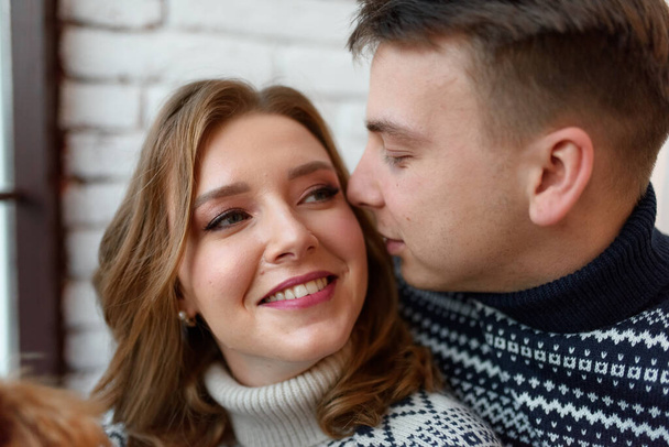 Image of young happy man kissing and hugging beautiful woman - Foto, Bild