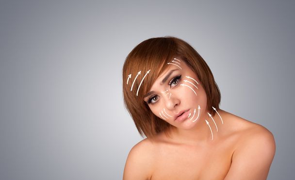 Beautiful girl with facial arrows on her skin - Fotó, kép