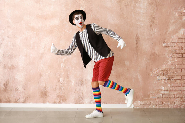 Male pantomimist on color background - Photo, Image