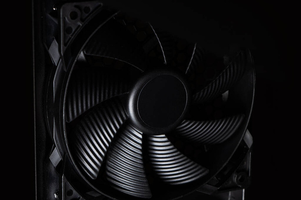 Cose up of computer fan on a dark background. - Photo, Image