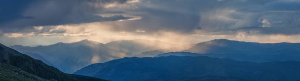Rainy weather in the mountains, evening light. Panoramic view. - Fotoğraf, Görsel