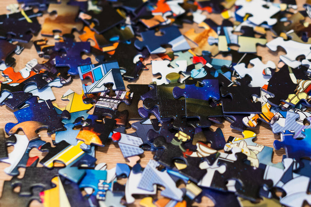 PO, POLAND - Mar 11, 2019: Colorful puzzle pieces laying on a table - Valokuva, kuva