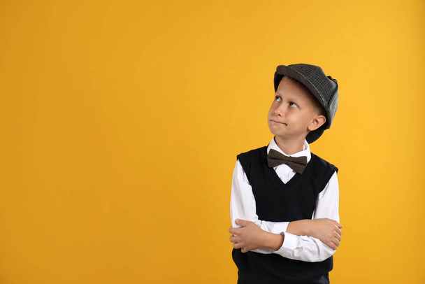Cute little detective on yellow background. Space for text - Photo, Image